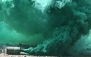 Smoke billowing from a green M18