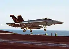NK-200, the CAG Bird of VFA-115, launch from the USS Abraham Lincoln (CVN-72) on October 9, 2002.