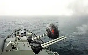 Almirante Grau firing her guns