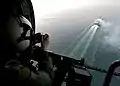 US Navy door gunner in 2000, in response to the attack on the USS Cole Navy door gunners now provide stand off security against attack by small craft.