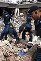 U.S. Navy personnel perform a search and rescue mission in Biloxi after Hurricane Katrina.