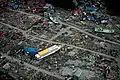 A large ferry boat rests inland amidst destroyed houses after a 9.0 earthquake and subsequent tsunami struck Japan March