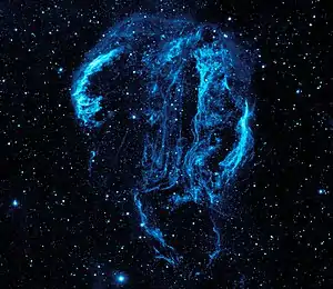 This GALEX image of the Cygnus Loop nebula could not have been taken from the surface of the Earth because the ozone layer blocks the ultra-violet radiation emitted by the nebula.
