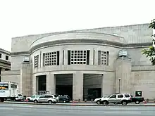 14th Street Entrance of USHMM. Large, rectangular façade with rounded opening.