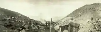 Panorama of the United Verde Smelter as it appeared in about 1909, replete with smoking smokestacks, many small buildings, and a curved section of railroad track