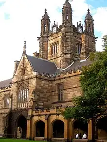 An ornately decorated red brick tower