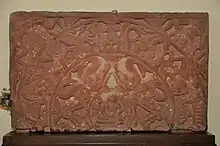 Upper Half of Ayagapatta with Miniature Tirthankara and other sacred symbols, circa 1st Century CE