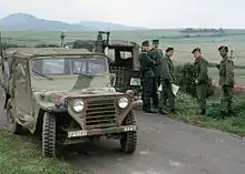 Group of three American soldiers, their M151 Truck, Utility, l/4-Ton, 4×4