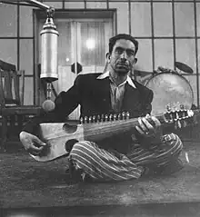 Ustad Mohammad Omar practicing rubab