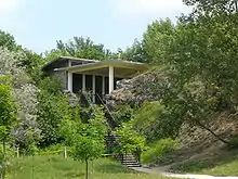 A modern building built between rocks