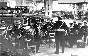 The Helsinki Police Band performing in a ceremony of Vanajan Autotehdas factory in 1957. The band is under the baton of Georg Malmstén.