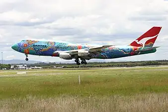 A Boeing 747-300 in 2004 wearing the Nalanji Dreaming livery. The aircraft carried the colour scheme from 1995 to 2005.