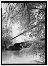 Exterior view of Southwest side of bridge from South bank of Sugar Creek