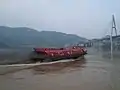 A hydrofoil boat leaving the Badong Port