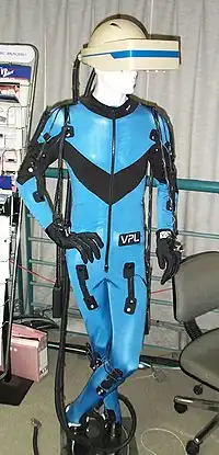 Image 9A VPL Research DataSuit, a full-body outfit with sensors for measuring the movement of arms, legs, and trunk. Developed circa 1989. Displayed at the Nissho Iwai showroom in Tokyo (from Virtual reality)