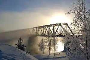 Mist rising from Oulujoki river embraces the Vaalankurkku railway bridge near Vaala station.