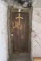 A grapevine cross inlay on a door in Vardzia cave monastery, Georgia