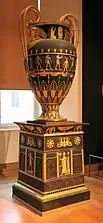 Egyptian Revival vase with pedestal; 1804-1806; varnished sheet and gilded bronze; height: 1.80 m, depth: 0.95 m; Louvre