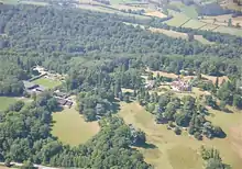 an aerial view of the park, the house is to the right, the walled garden is to the left