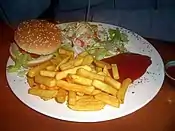 Order from a vegetarian deli: veggie burger with French fries and salad