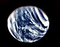 Mariner 10's photograph of Venus in ultraviolet light (photo color-enhanced to simulate Venus's natural color as the human eye would see it)