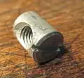 A 10 mm long barrel nut with M6 threads