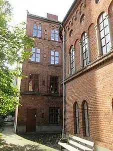 The rear side of the cross wing viewed along the east side of the Library Building.