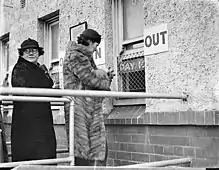 Collecting winnings, Victoria Park racecourse.