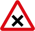 Intersection ahead in which priority must be given to vehicles on the right.