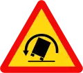 201c: Curve to the left with a danger of vehicle rollover