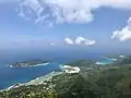 The view from Morne Blanc facing west.  Port Glaud is in the foreground.  The islands Therese and Conception are in the distance.  The bay to the right is Port Launay Marine National Park.