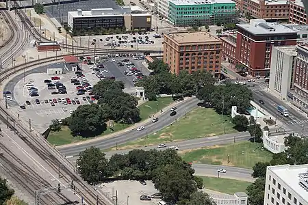 Dealey Plaza (2015) as viewed from Reunion Tower. Shown are the Texas School Book Depository and the "grassy knoll" in the upper center, the seven-story Dal-Tex Building, and the Dallas County Records Building.