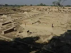 Archaeological site with some brick walls visible
