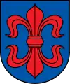 A coat of arms depicting a large, red fleur-de-lis that has a horizontal symmetry axis all on a blue background bordered by a black line