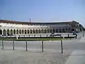 The porticoed hemicycle of the piazza