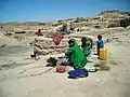 A mother with her children in a village near Charghcharan