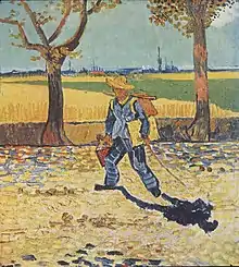 A man wearing a straw hat, carrying a canvas and paintbox, walking to the left, down a tree-lined, leaf-strewn country road