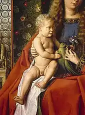 The Madonna holds the Child in her right arm and a flower in her left. Her red gown is heavily folded, and she is surrounded by the oriental patterns of the overhanging tapestry.