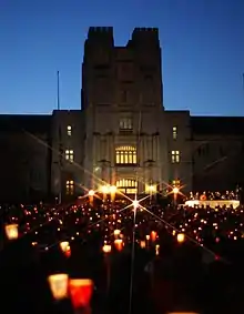 A crowd of people holding candles.