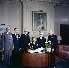 Visit of Prince Philip (seated) to the Royal Society of Canada. Officers of the Society (standing left to right): Dr. Charles Camsell, Dr. Loris Shano (L.S.) Russell, Dr. T.W.N. Cameron, president Leon Marion and Colonel C.P. Stacey in 1957.