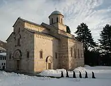 Stone church with various towers.