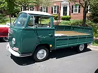 Volkswagen Type 2 with single cab over and a dropside bed with the left panel folded down