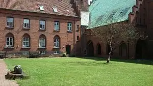 The (former) priory attached to the Church of Our Lady has official address at Klostergade.