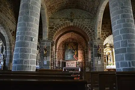 The central nave, choir, and aisles are illuminated by the southern apse on the right.