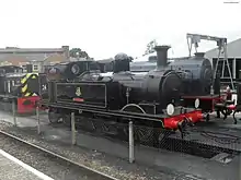 W24 Calbourne at Havenstreet station (Isle of Wight Steam Railway) in August 2010. Also visible are British Railways Class 03 No D2059 and WD92 Waggoner.