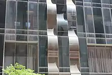 A portion of the lower-story facade of One57 with wavy vertical strips