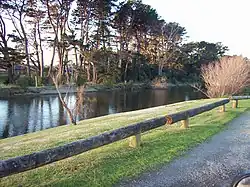 The Waikanae River as viewed from its southern bank in Otaihanga.  Across the river is the town of Waikanae Beach.