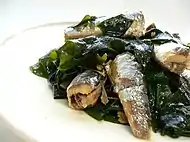 A Japanese dish with garlic, wakame, soy sauce, and "oil saldina"