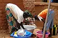 Two women wash the dishes at the hotel Nomad, Bani, 2010