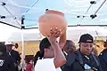 Water Utilities Corporation at WTISD 2017, a woman holding Clay pot.